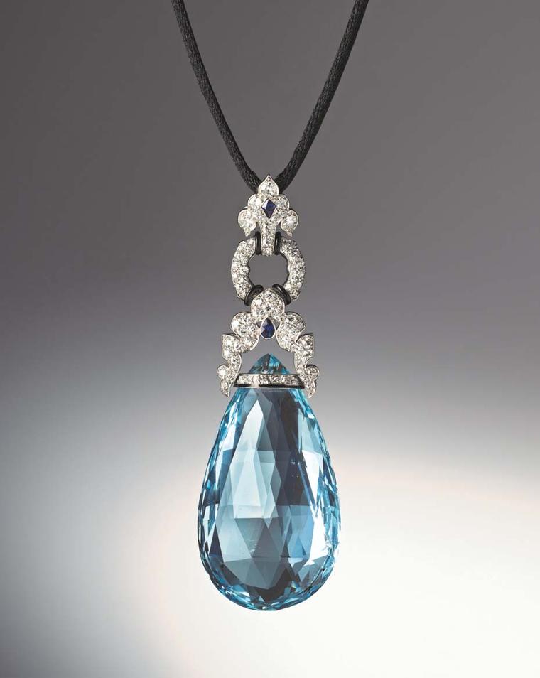 Art Deco aquamarine briolette pendant set with diamonds, two fancy-cut sapphires, as well as bands of black enamel set in platinum by Marzo, Paris, circa 1925. Available at Hancocks.